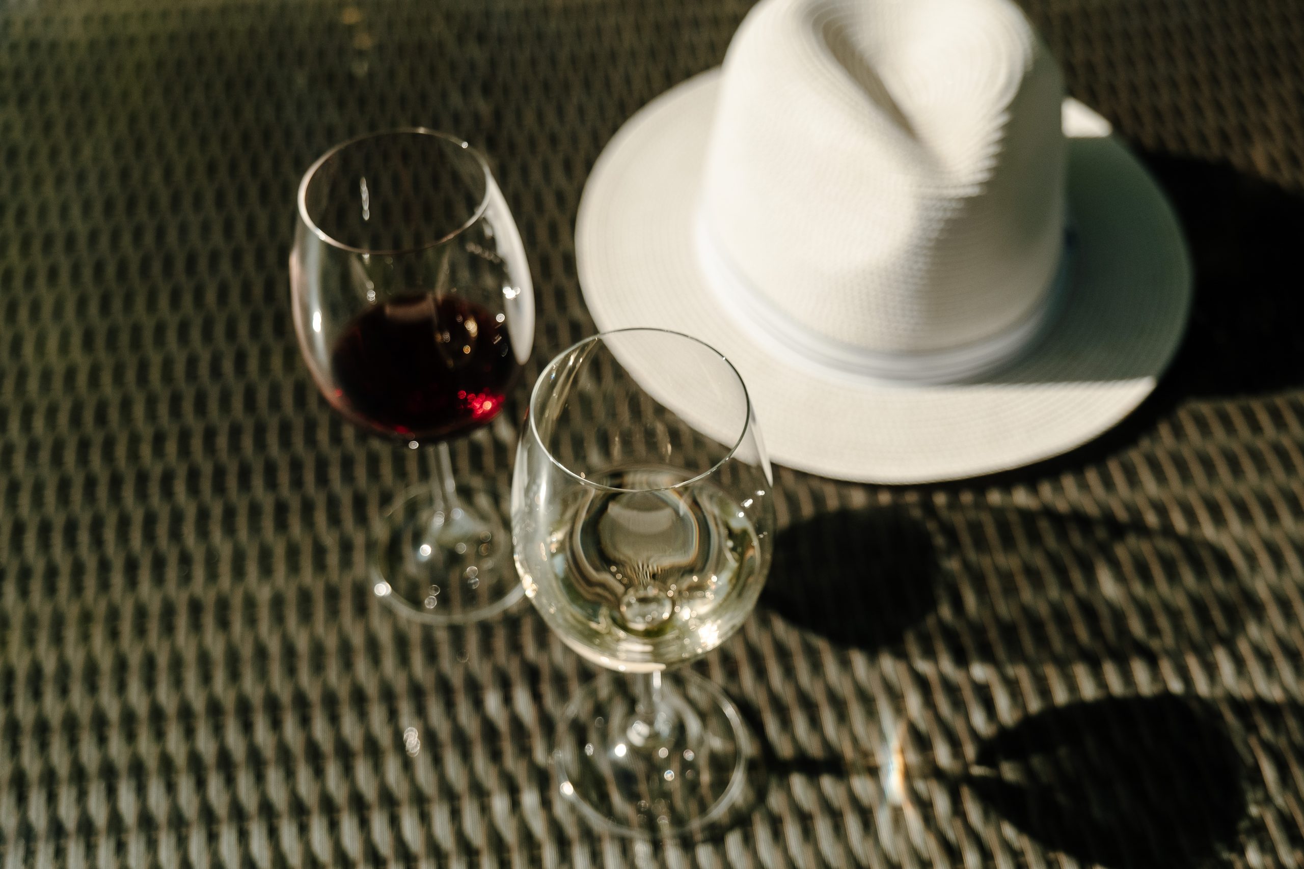 Hat and two wine glasses
